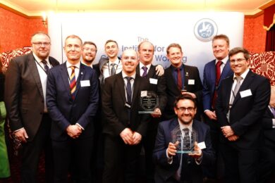 Group photo of the teams with their trophies at the Institute of Collaborative Working Awards